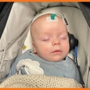 Small sticky pads on a baby while its sleeping